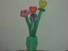 Wonderful balloon vase with flowers and hearts blooming.