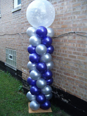 Large column with spiraling colors, all topped off with a gigantic 3 foot balloon!